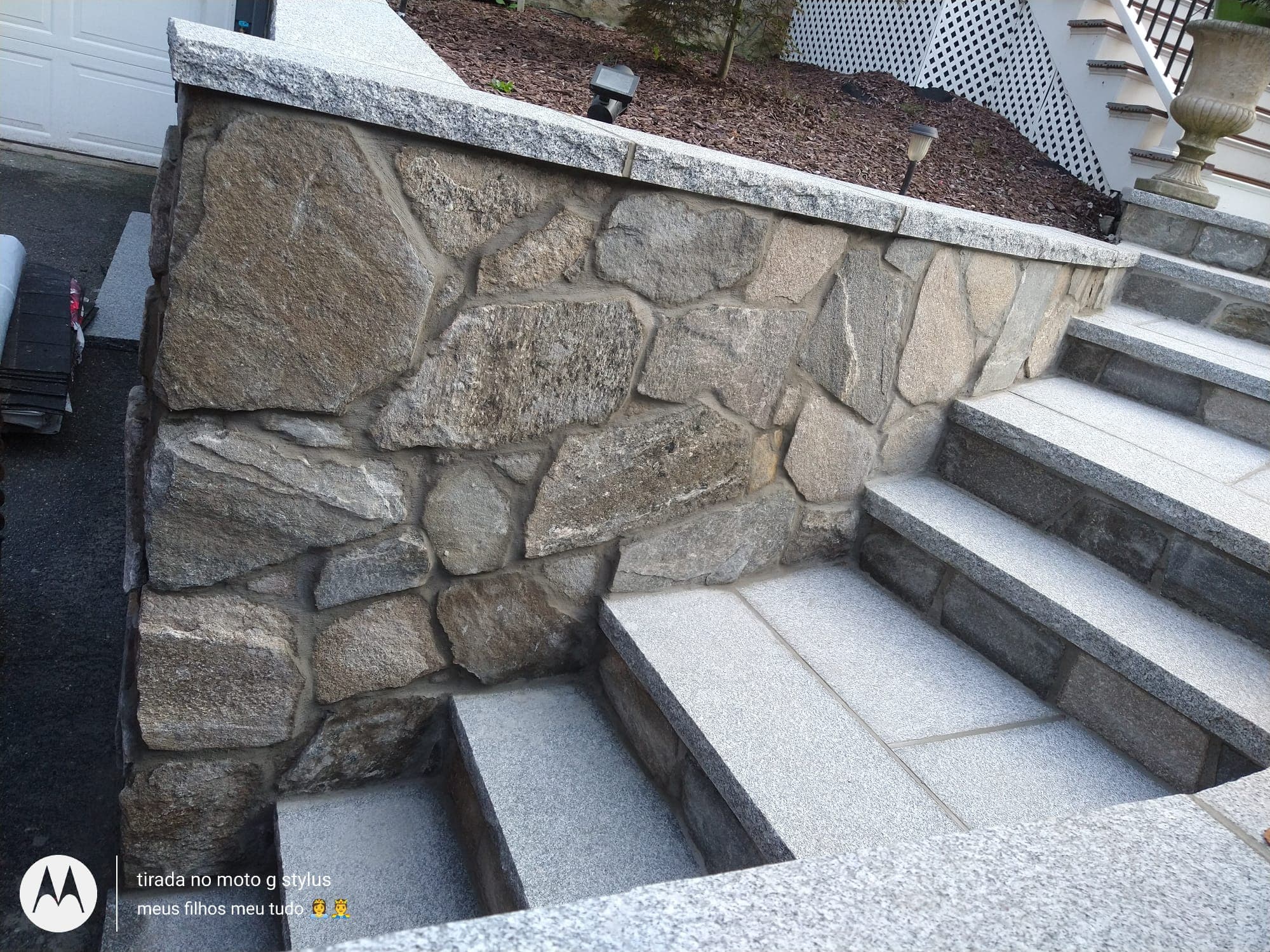Fieldstone stoop with granite tread caps